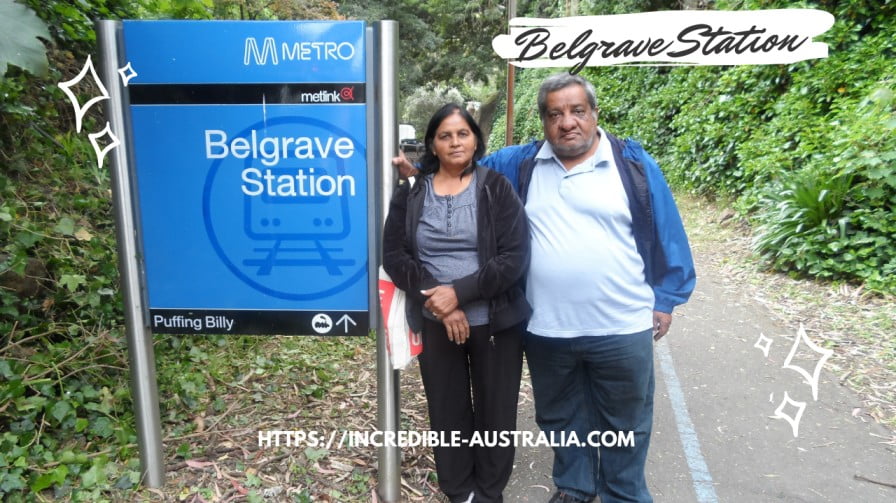 My parents at Belgrave Station (sign which will take you to Puffing Billy )